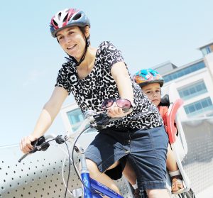 Summer cycling with young boy in child seat (Temple Quay bridge, June 2009)